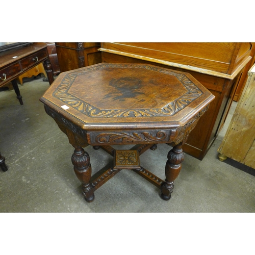 142 - A Victorian Jacobean Revival carved oak octagonal centre table