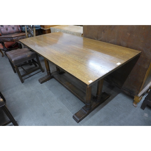 143 - A Heals style oak Churchill refectory table, manner of Philip Tilden