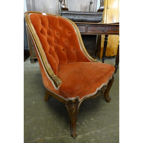 149 - A French carved walnut and fabric upholstered lady's chair