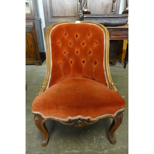 149 - A French carved walnut and fabric upholstered lady's chair