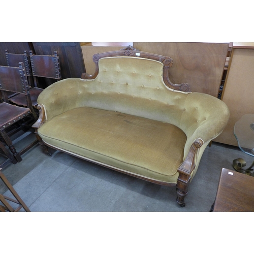 156 - A Victorian carved walnut and fabric upholstered settee