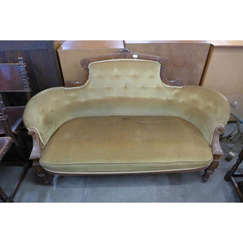 156 - A Victorian carved walnut and fabric upholstered settee