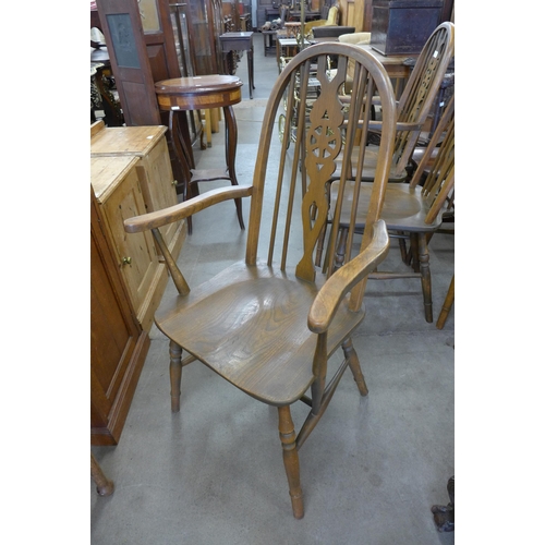 170 - A set of six elm and beech wheelback kitchen chairs