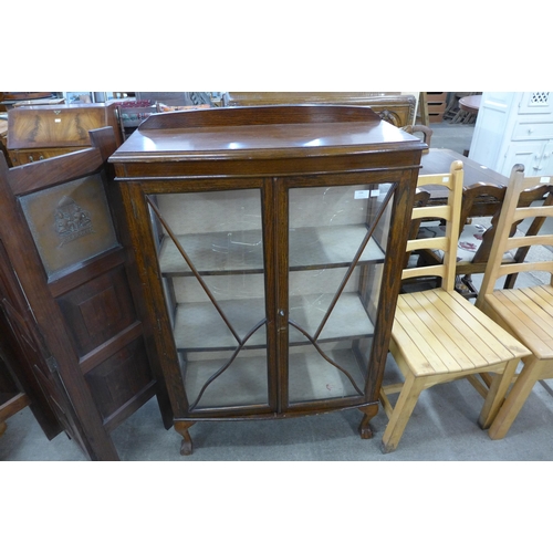 194 - An oak two door bow front display cabinet