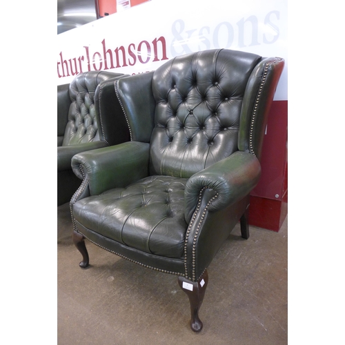 2 - A green leather Chesterfield wingback armchair