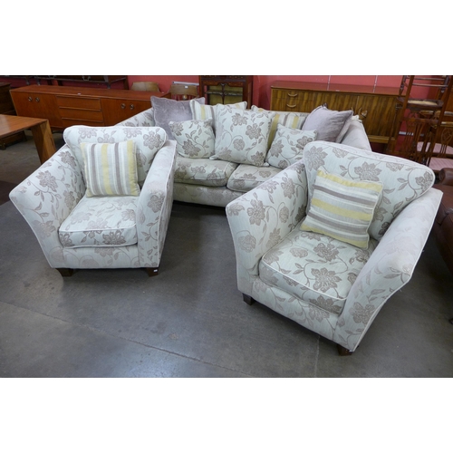 206 - A fabric upholstered Knole drop-arm settee and pair of matching armchairs