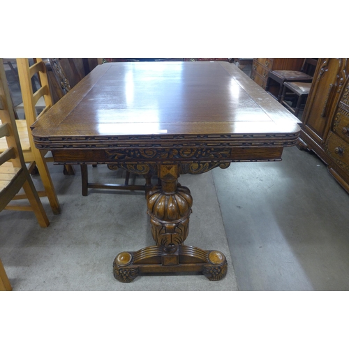 210 - An early 20th Century carved oak six piece dining suite, comprising; a draw-leaf table, four chairs ... 