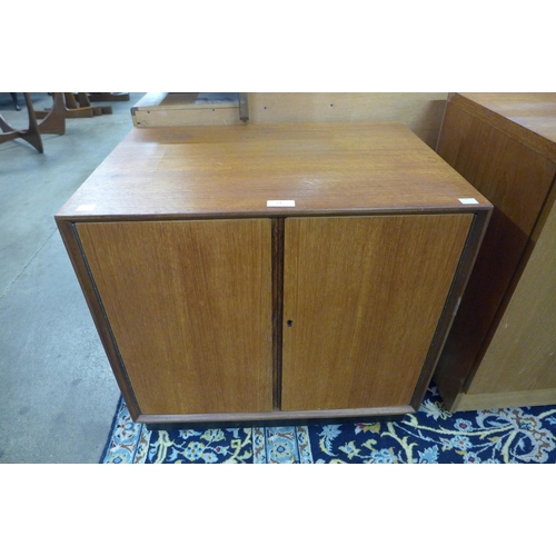 24 - A teak two door record cabinet