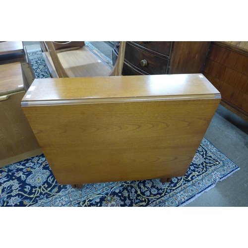 26 - A McIntosh teak drop-leaf table