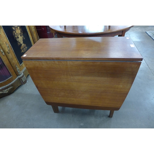 28 - A teak drop-leaf table