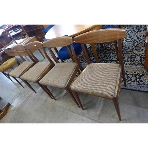 30 - A set of four teak dining chairs