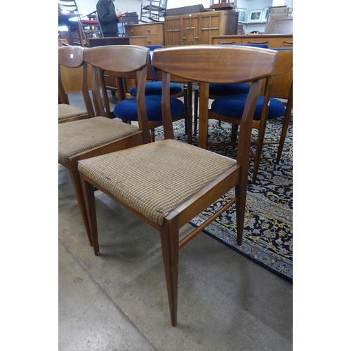 30 - A set of four teak dining chairs