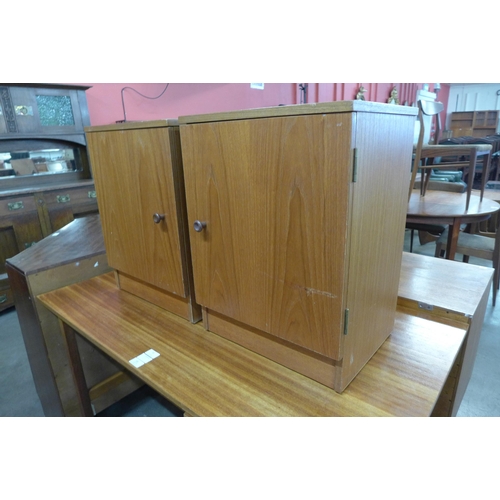 32 - A pair of Austin Suite teak bedside cabinets