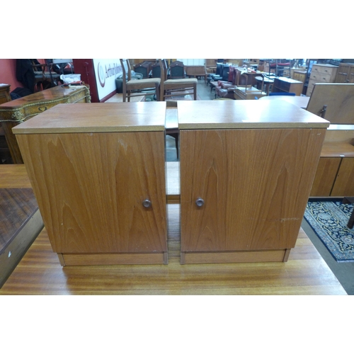 32 - A pair of Austin Suite teak bedside cabinets