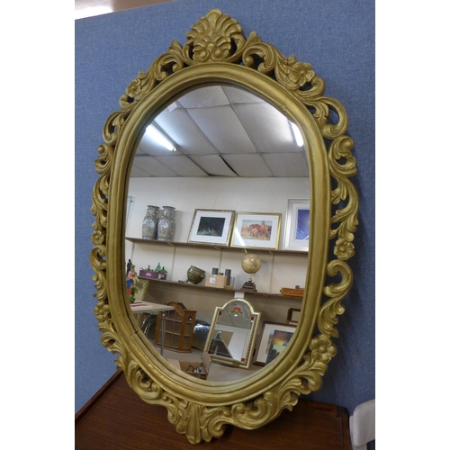 322A - A Rococo style gilt framed mirror