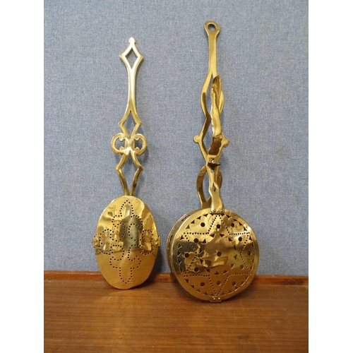 354 - Two pierced brass chestnut roasters