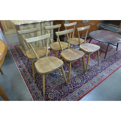 36 - A set of six Ercol Blonde elm and beech 392 adult model stacking chairs