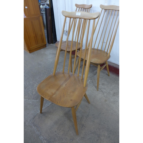 36A - A set of three Ercol Blonde elm and beech Goldsmith chairs