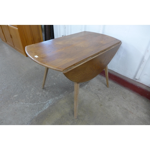 36B - An Ercol Blonde elm and beech Windsor drop leaf table