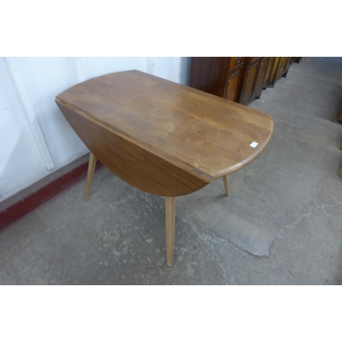 36B - An Ercol Blonde elm and beech Windsor drop leaf table