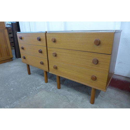 36D - A pair of teak chests of drawers