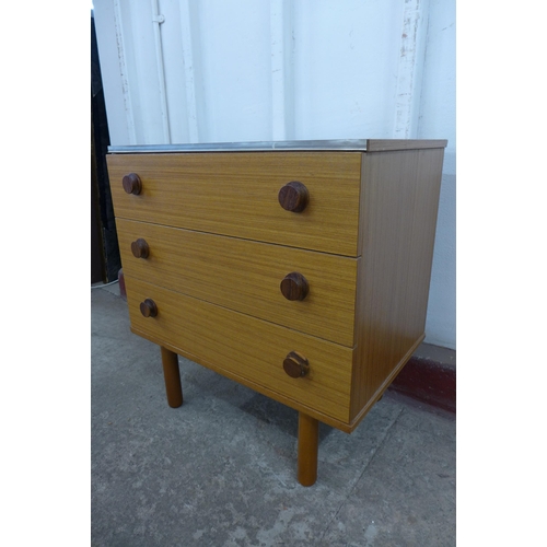 36D - A pair of teak chests of drawers