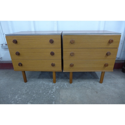 36D - A pair of teak chests of drawers