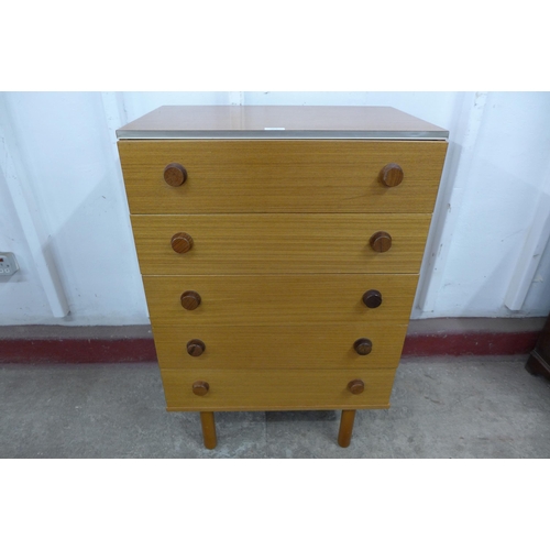 36E - A teak chest of drawers