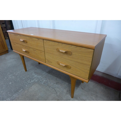 36N - A small Austin Suite teak four drawer sideboard