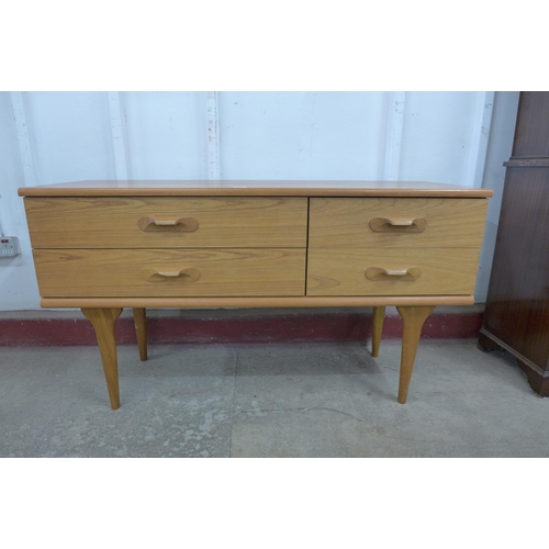 36N - A small Austin Suite teak four drawer sideboard