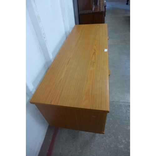 36N - A small Austin Suite teak four drawer sideboard