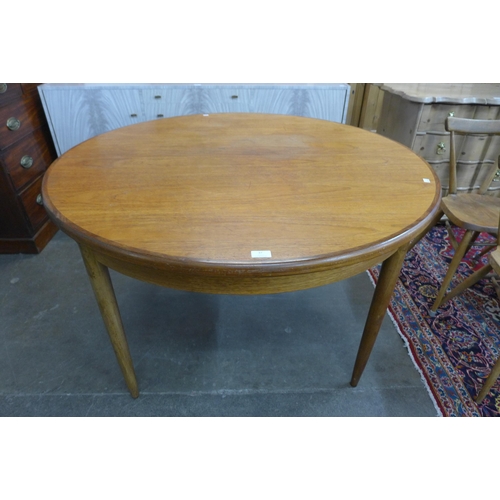 37 - A G-Plan Fresco teak circular extending dining table