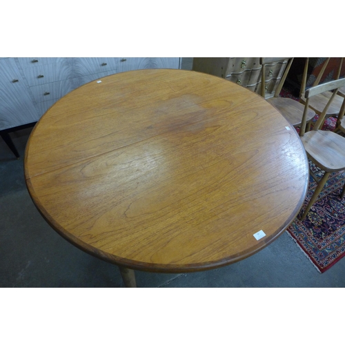 37 - A G-Plan Fresco teak circular extending dining table