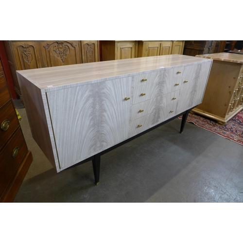 38 - An Italian simulated marble sideboard