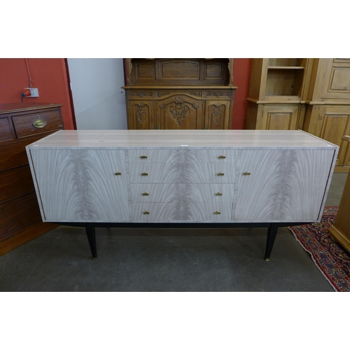 38 - An Italian simulated marble sideboard