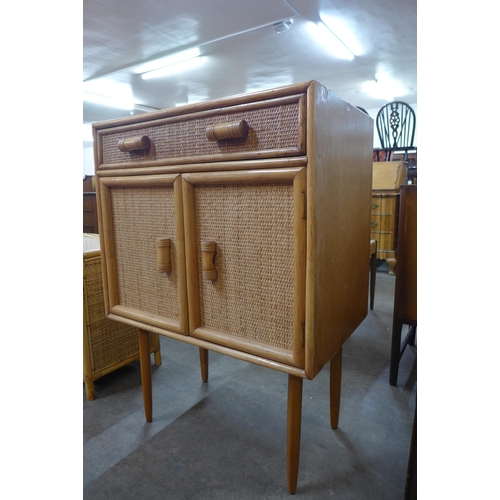 45 - An Italian bamboo and rattan cabinet on stand