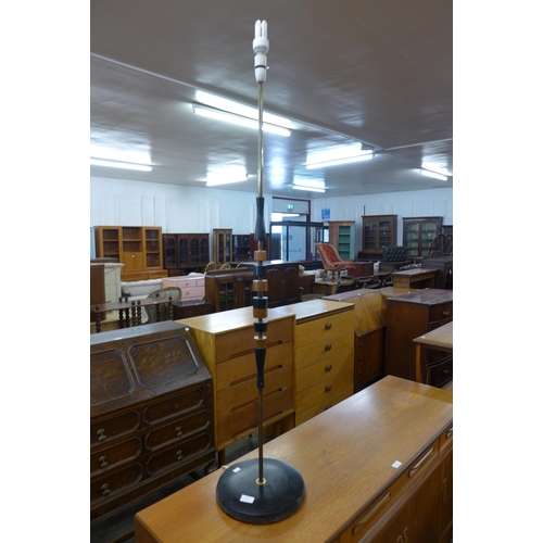 61 - A teak and ebonised standard lamp