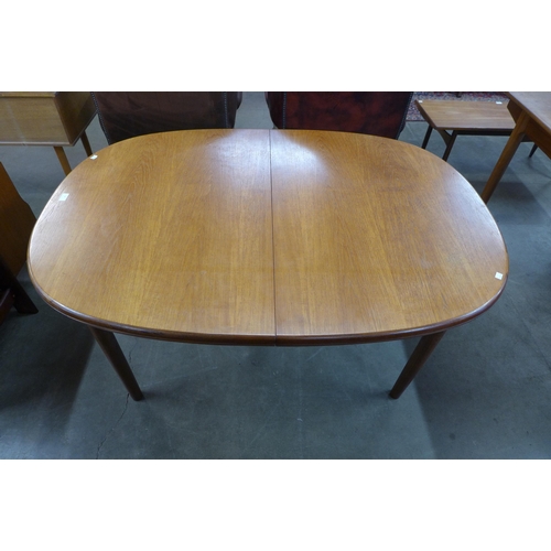 68 - A McIntosh teak extending dining table