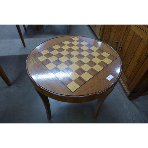 69 - A teak circular occasional/games table