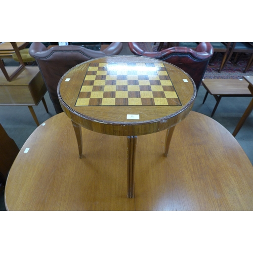 69 - A teak circular occasional/games table