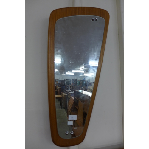 75 - An asymmetric teak framed mirror