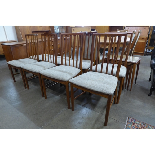 77 - A McIntosh teak extending dining table and eight chairs