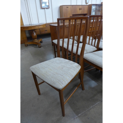 77 - A McIntosh teak extending dining table and eight chairs