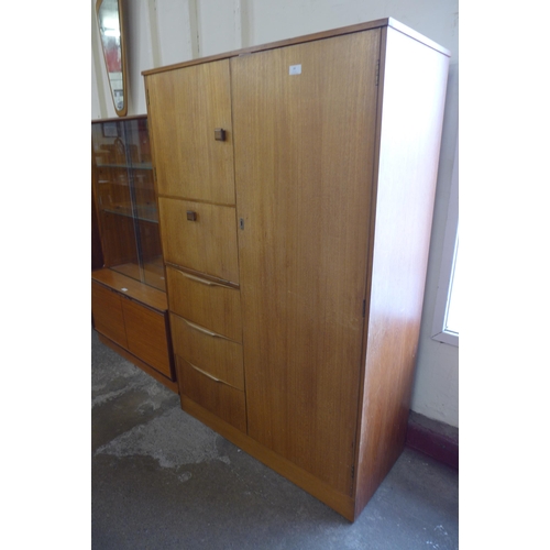 84 - A teak tallboy