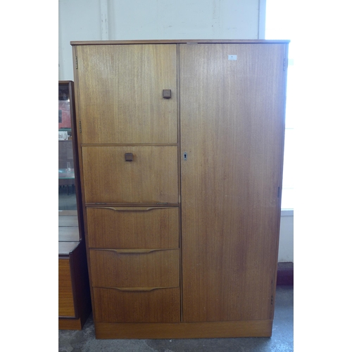 84 - A teak tallboy