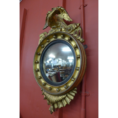 88 - A Regency gilt framed convex mirror