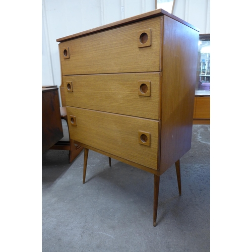 9 - A teak chest of drawers