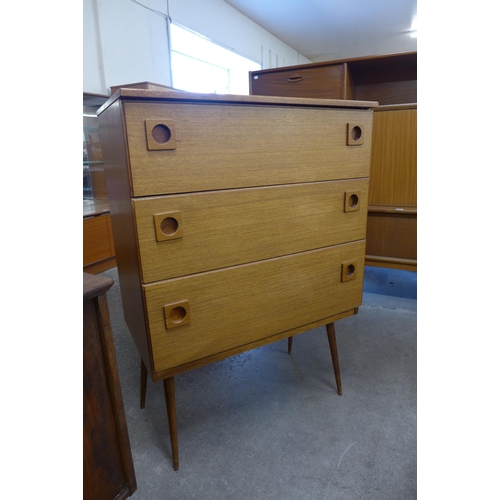 9 - A teak chest of drawers