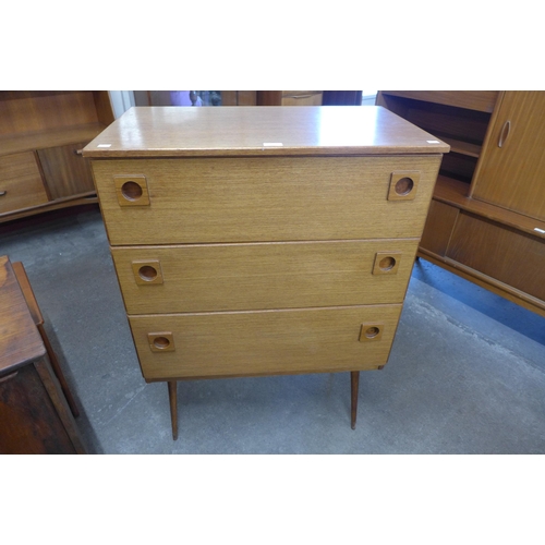 9 - A teak chest of drawers