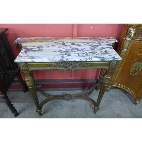 91 - A French Louis XIV style carved gilt and marble topped console table